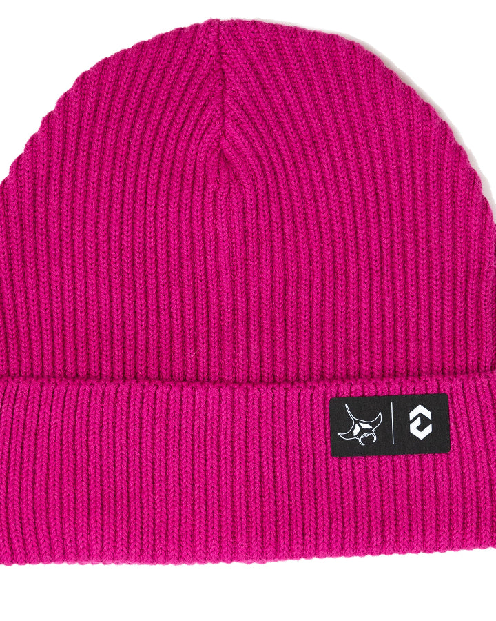 Pink beanie with a black label DynamicNord Logo