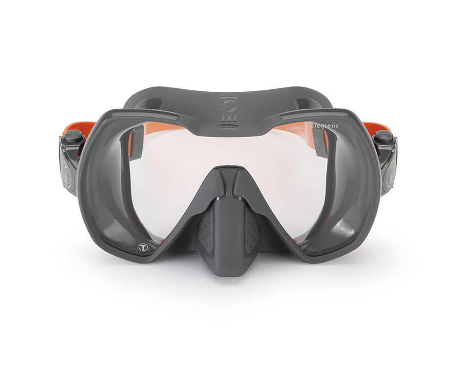 A grey diving mask with a single lens and a soft silicone skirt, designed for wide field of vision and comfortable fit.