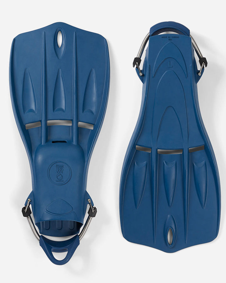 A pair of blue Tech Fins designed for scuba diving, featuring a vented blade and spring straps.
