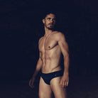 Men wearing teh Fourth Element Tima Swim Trunk 